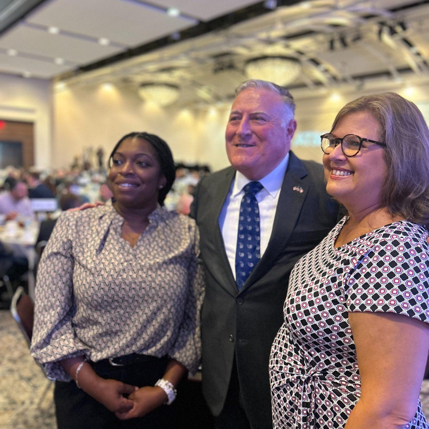 John King with supporters at a chamber event